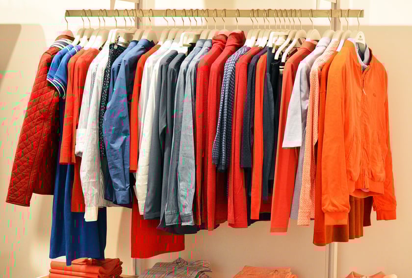 Colorful Clothes Hanging on a Rack